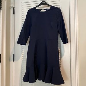 Navy blue Warehouse dress. Eye-catching open back design.